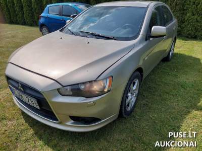 Lengvasis automobilis Mitsubishi Lancer 2009m. geltonas benzinas 2400 EUR aukcione